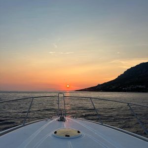 View of the sunset from the bow of a yacht in Croatia.