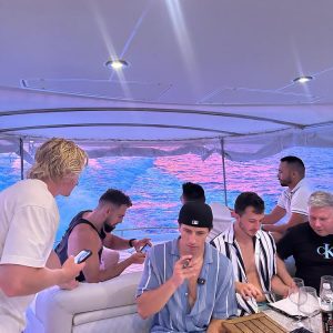 Friends enjoying an evening yacht party in Croatia.