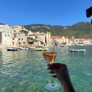 Cocktail in hand overlooking a Dalmatian coastal town